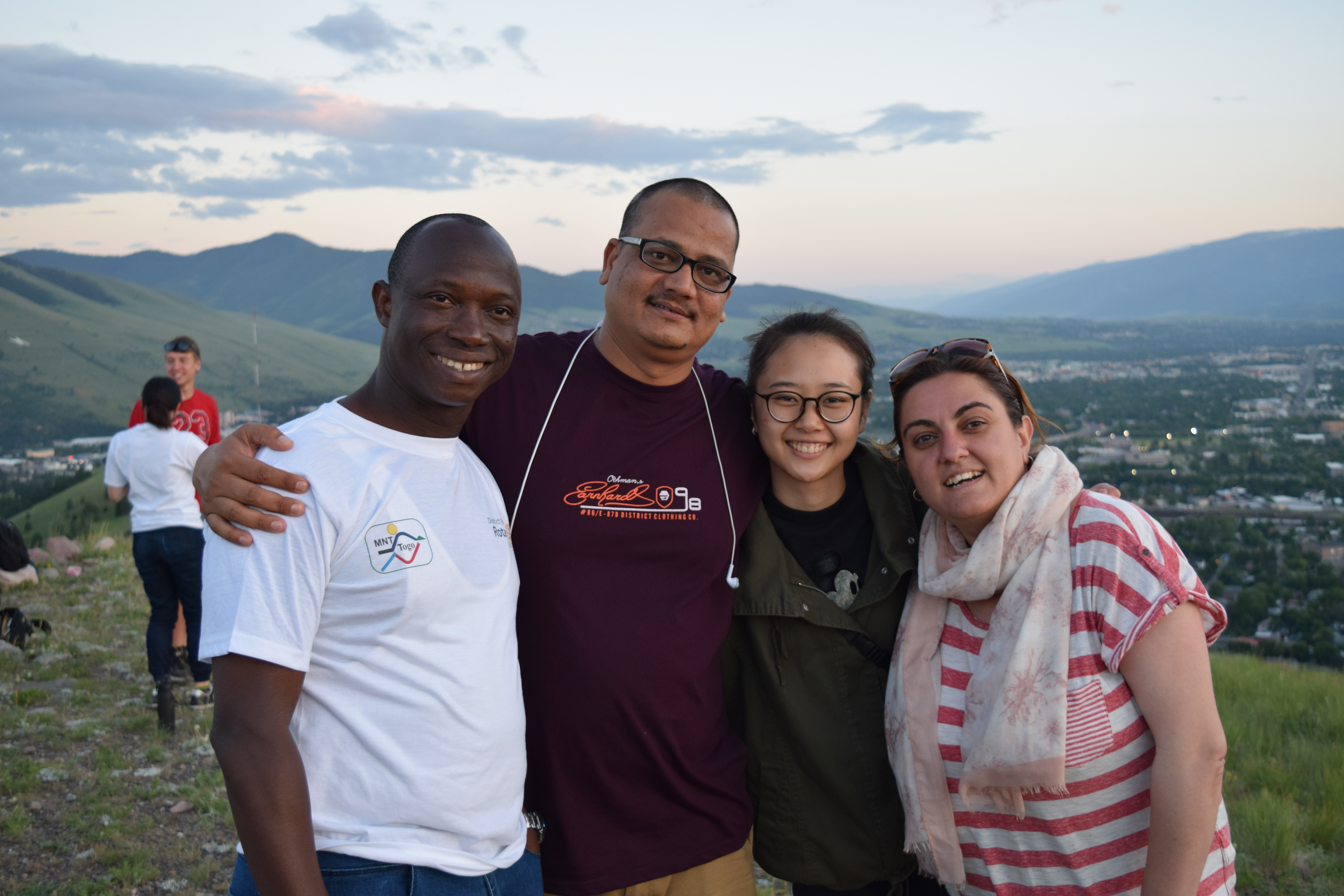 Four people at the top of hill